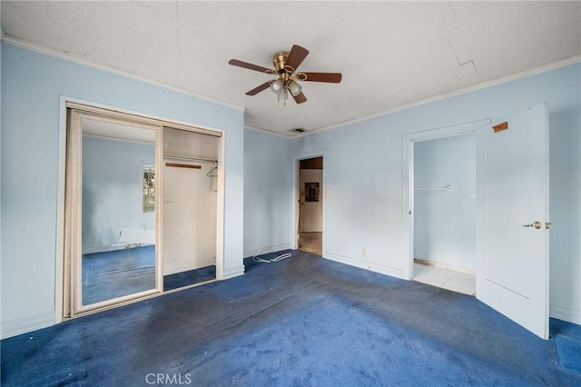 unfurnished bedroom with crown molding, carpet floors, and ceiling fan