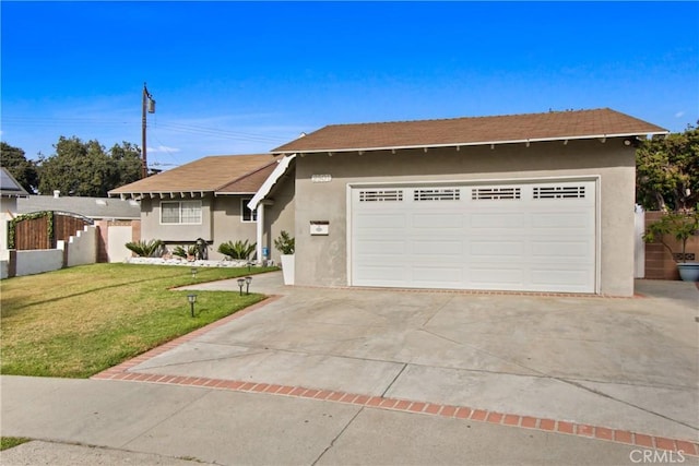 view of front of home featuring a garage and a front yard