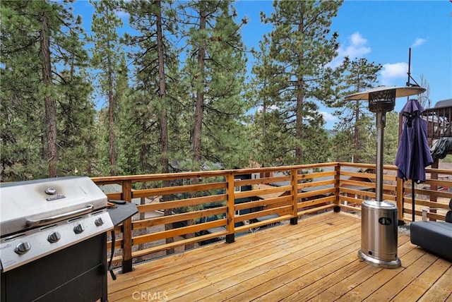 wooden terrace featuring grilling area