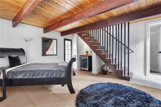 bedroom featuring beamed ceiling and wood ceiling