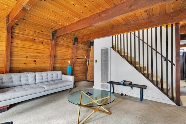 living room with carpet flooring, beam ceiling, and wooden ceiling