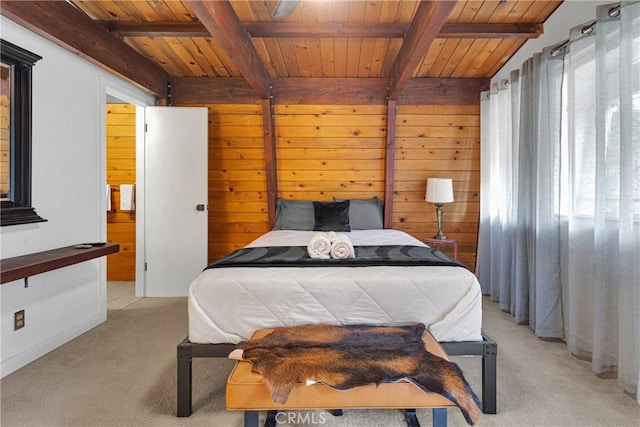 bedroom featuring beamed ceiling, light colored carpet, wood ceiling, and wooden walls