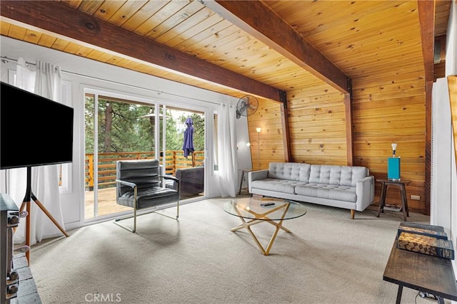 living room with beamed ceiling, wood walls, wooden ceiling, and carpet floors