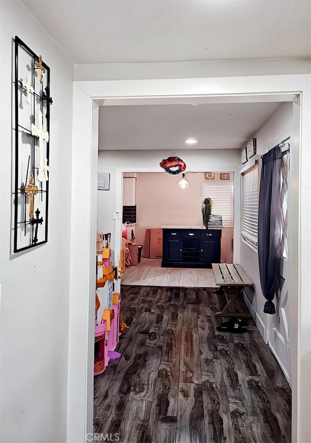 hallway featuring hardwood / wood-style flooring