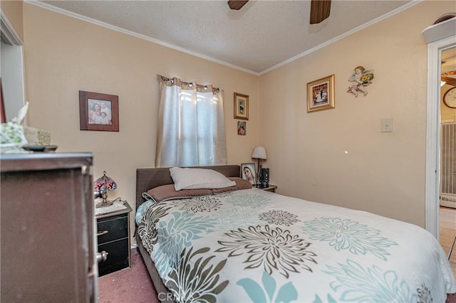 carpeted bedroom featuring a textured ceiling, ceiling fan, and crown molding