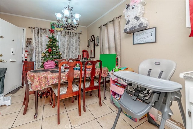 tiled dining room featuring a chandelier and ornamental molding