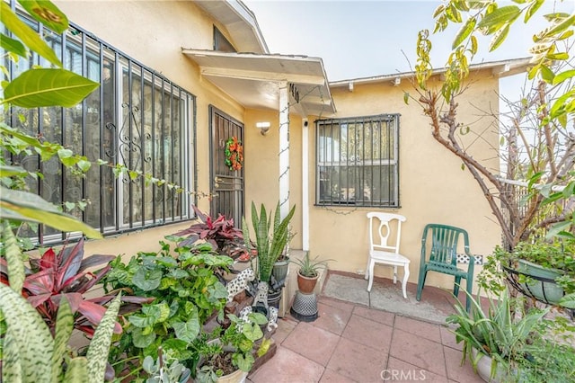 property entrance featuring a patio