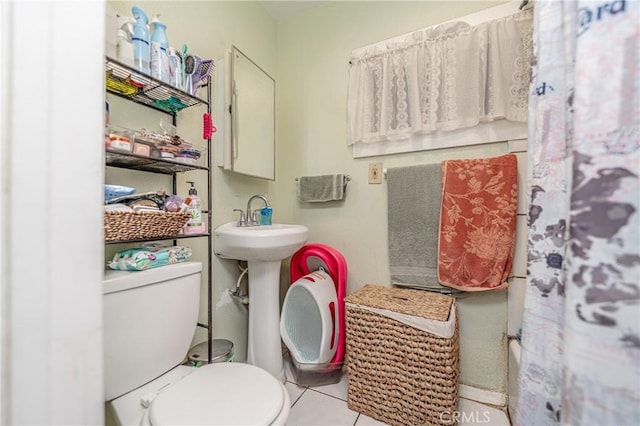 bathroom featuring tile patterned floors and toilet