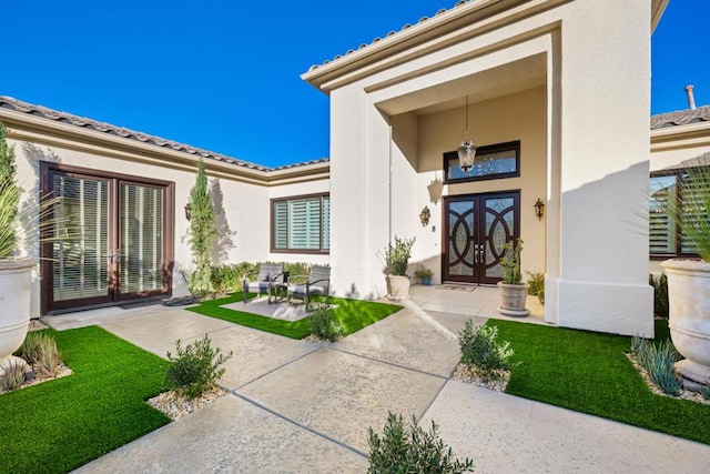 view of exterior entry with french doors