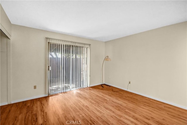 spare room featuring hardwood / wood-style floors