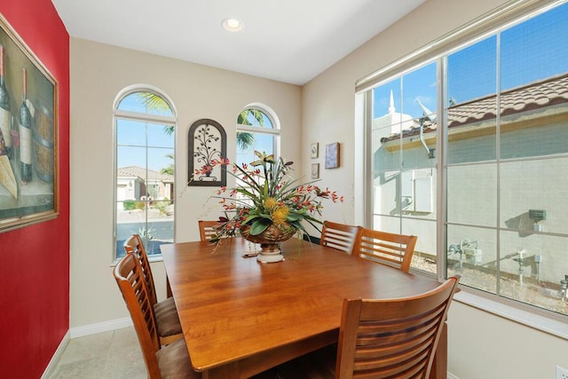 dining area with light tile patterned flooring