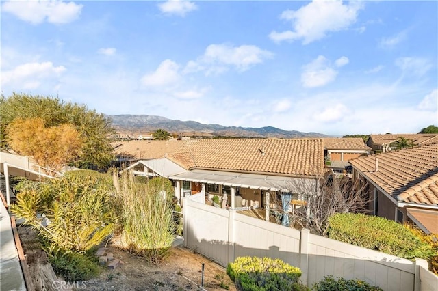 2028 Melbourne Cir, Banning, CA 92220 - rear view of property with a tiled roof and a mountain view