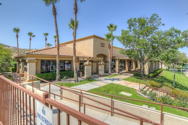 2028 Melbourne Cir, Banning, CA 92220 - back of house featuring stucco siding and a tiled roof