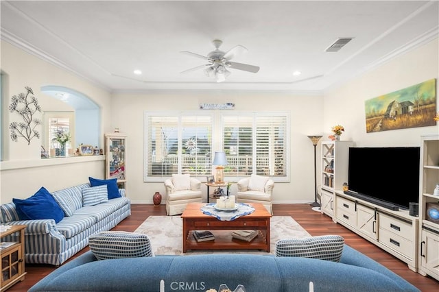 living room with ceiling fan, dark hardwood / wood-style floors, and crown molding