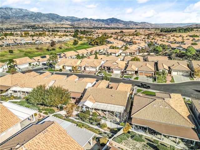 birds eye view of property with a mountain view