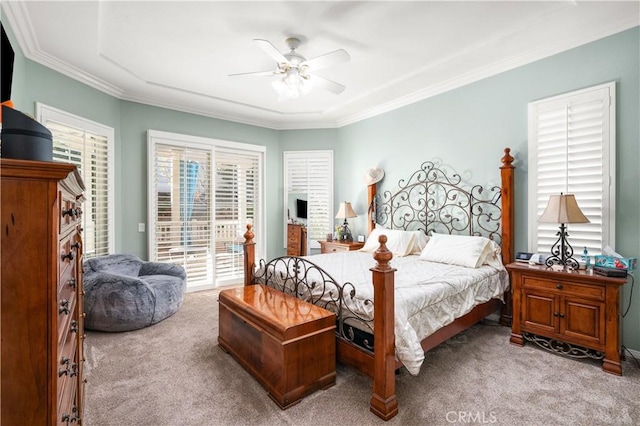 bedroom featuring ceiling fan, light colored carpet, access to outside, and multiple windows