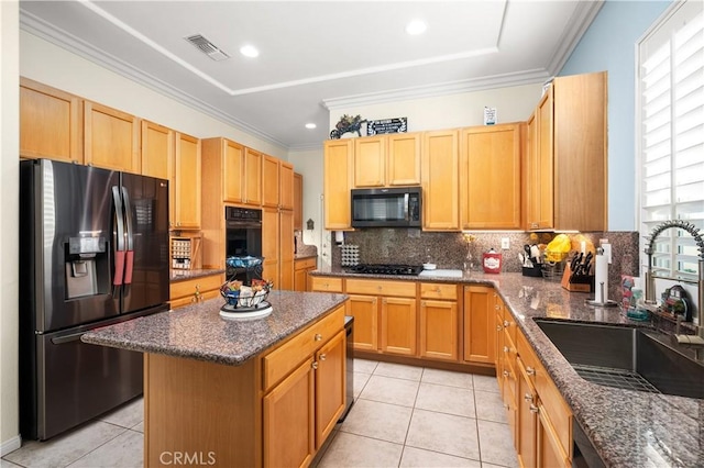 kitchen with a center island, sink, crown molding, light tile patterned floors, and black appliances