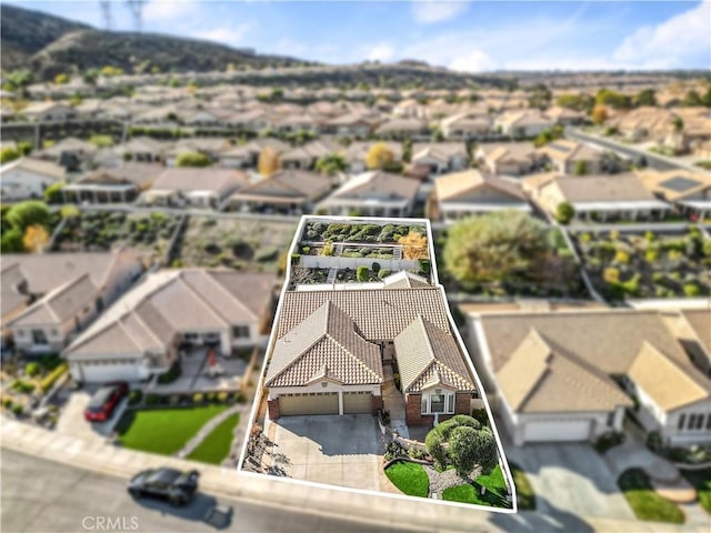 2028 Melbourne Cir, Banning, CA 92220 - aerial perspective of suburban area featuring property parcel outlined and a mountain backdrop