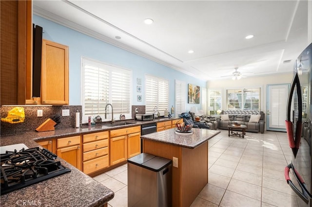 2028 Melbourne Cir, Banning, CA 92220 - kitchen featuring a sink, black appliances, light tile patterned floors, open floor plan, and a kitchen island