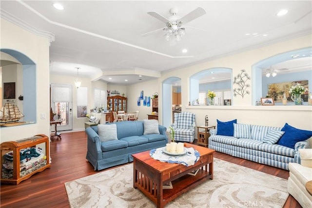 living room with ceiling fan, wood-type flooring, and crown molding