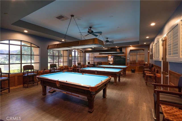 playroom featuring wood walls, a raised ceiling, ceiling fan, pool table, and wood-type flooring