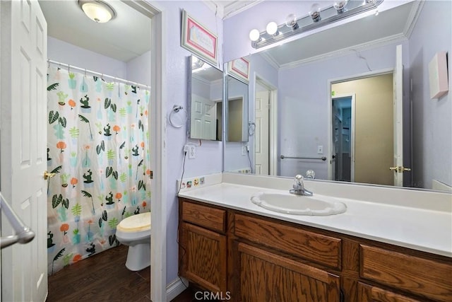 full bathroom featuring shower / tub combo, vanity, crown molding, hardwood / wood-style floors, and toilet