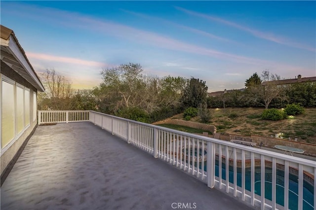 balcony at dusk with a patio area