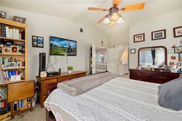 carpeted bedroom featuring ceiling fan and lofted ceiling