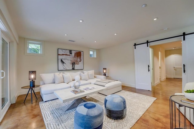 living room featuring plenty of natural light and a barn door