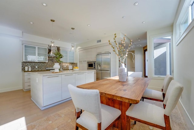 dining area with light hardwood / wood-style floors