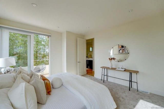 bedroom featuring light colored carpet