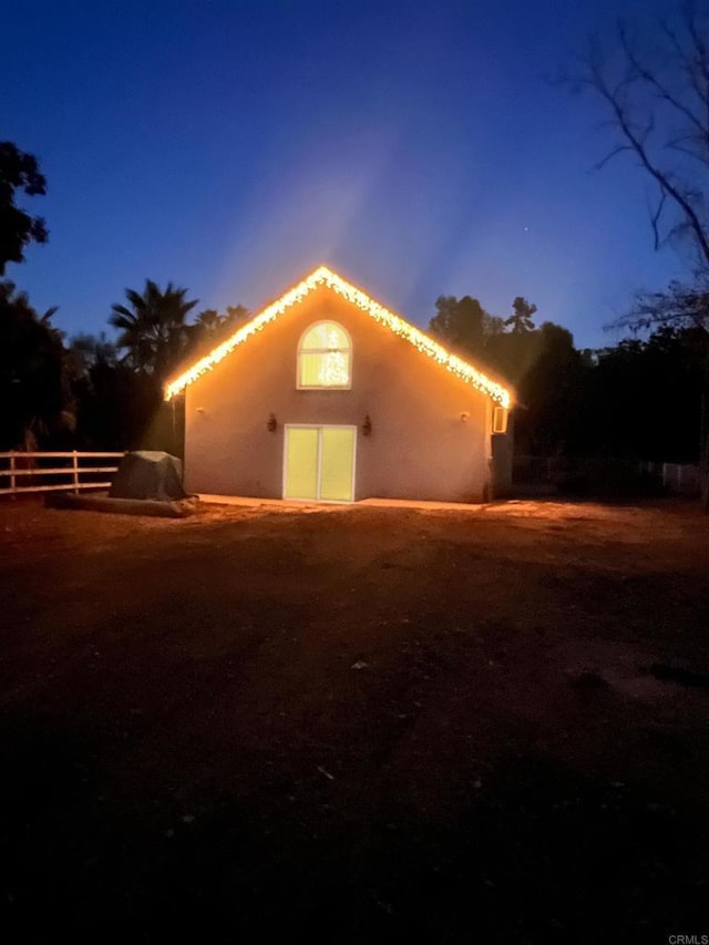 view of back house at dusk