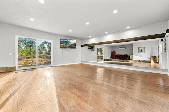 unfurnished living room featuring light hardwood / wood-style floors