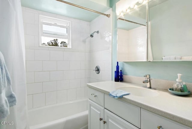 bathroom featuring vanity and shower / bath combo with shower curtain