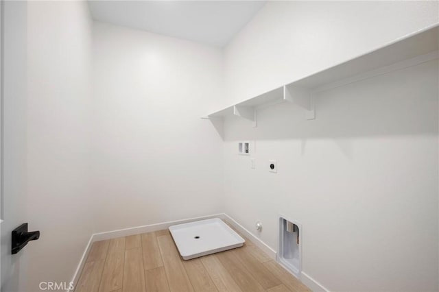 23724 Wilcox Dr, Newhall, CA 91321 - washroom featuring gas dryer hookup, washer hookup, hookup for an electric dryer, and light wood-style flooring