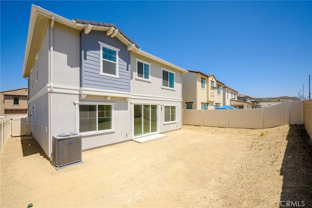 23724 Wilcox Dr, Newhall, CA 91321 - rear view of property with a fenced backyard, stucco siding, and a patio area