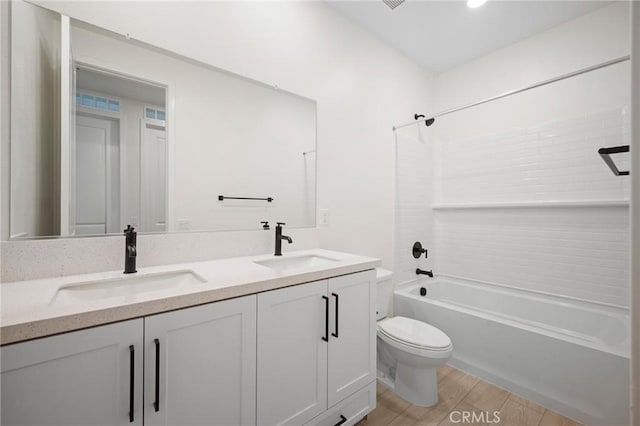 full bathroom with wood-type flooring, vanity, toilet, and shower / bathtub combination