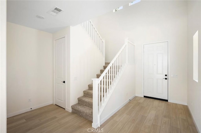 23724 Wilcox Dr, Newhall, CA 91321 - staircase with wood finished floors and baseboards