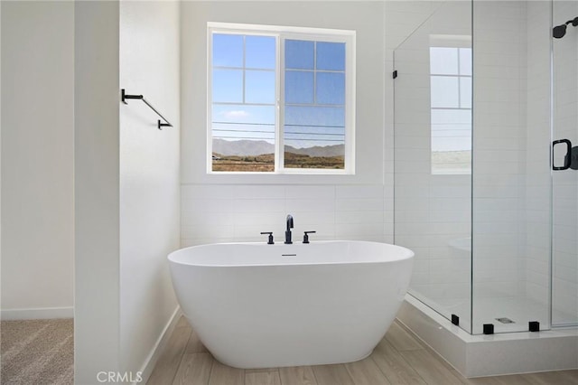 23724 Wilcox Dr, Newhall, CA 91321 - full bath with a stall shower, a soaking tub, and tile walls
