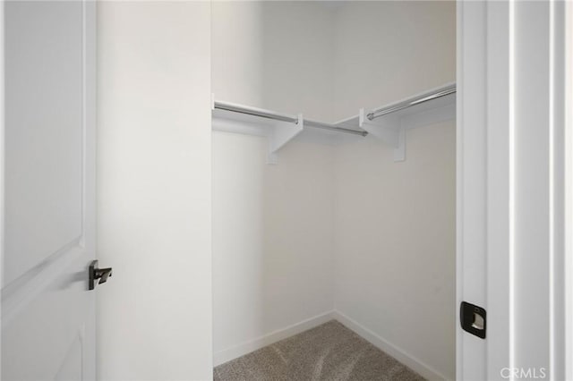 23724 Wilcox Dr, Newhall, CA 91321 - walk in closet featuring carpet