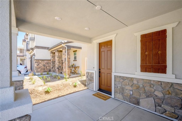 23724 Wilcox Dr, Newhall, CA 91321 - view of exterior entry featuring stone siding and stucco siding