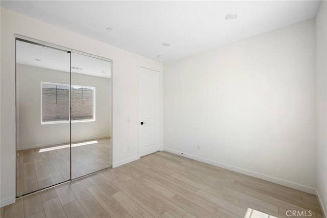 23724 Wilcox Dr, Newhall, CA 91321 - unfurnished bedroom with wood finished floors and a closet