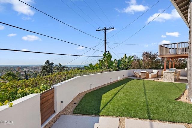 view of yard with a patio area, fence, an outdoor living space, and area for grilling