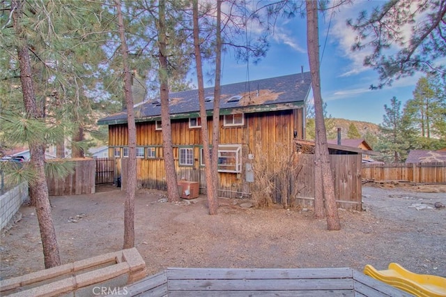 rear view of property featuring a mountain view