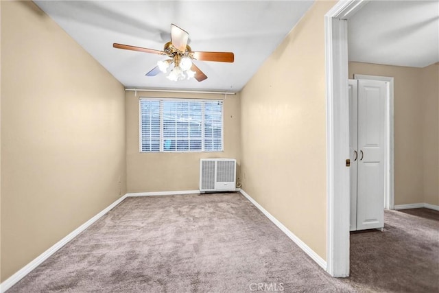 unfurnished room with light colored carpet and ceiling fan