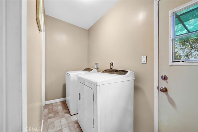 clothes washing area with independent washer and dryer