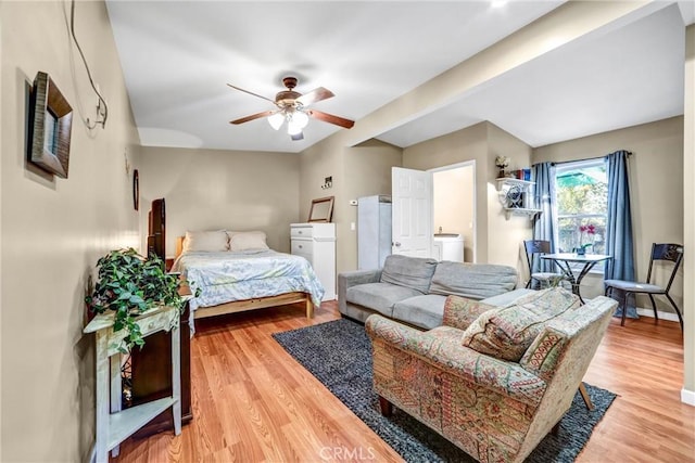 bedroom with ceiling fan and light hardwood / wood-style floors