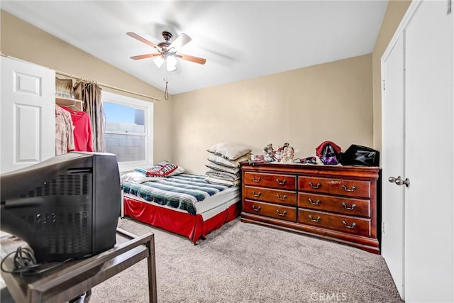 bedroom featuring ceiling fan, lofted ceiling, and carpet flooring