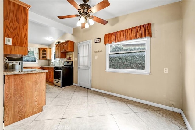 kitchen featuring vaulted ceiling, sink, backsplash, ceiling fan, and gas stove