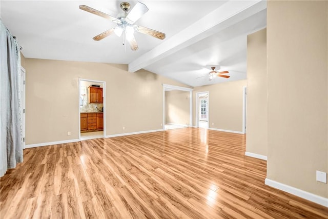 unfurnished living room featuring ceiling fan, vaulted ceiling with beams, and light hardwood / wood-style floors